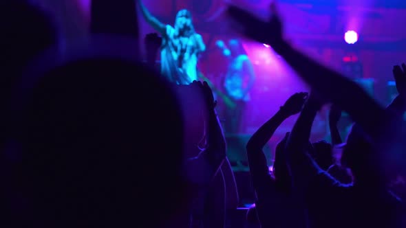 Hiphop Star Performing on Stage in Front of Fans