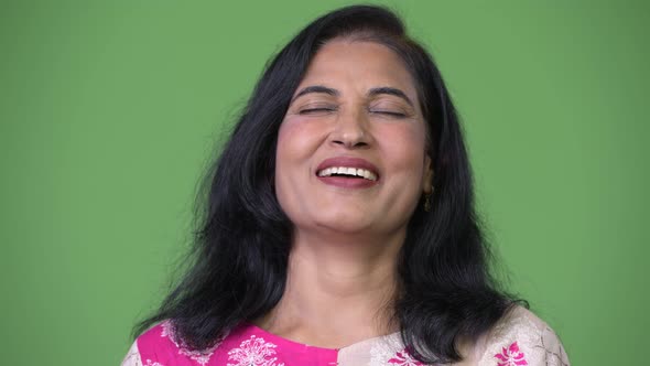 Mature Happy Beautiful Indian Woman Relaxing with Eyes Closed