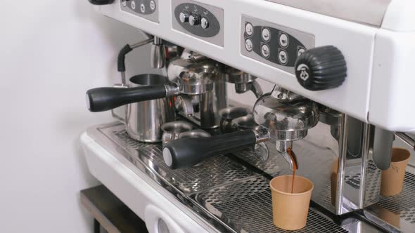 Barista Making Coffee in Takeaway Cups on Machine