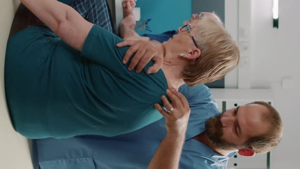 Vertical Video Physiotherapist Doing Physical Therapy Exercise with Old Patient