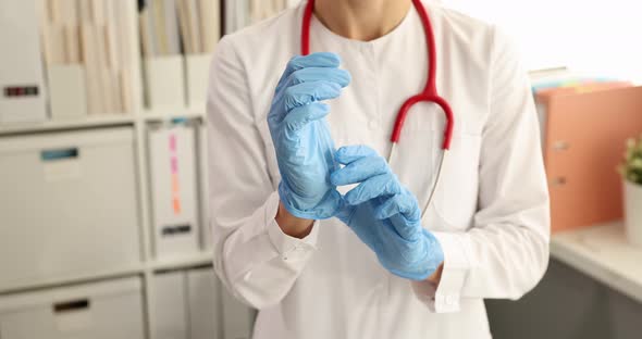 Doctor Puts Disposable Glove on Hand in Medical Office  Movie