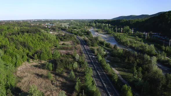 Aerial View Of Vehicles Driving The Road In Prahova Valley Near Campina, Romania.