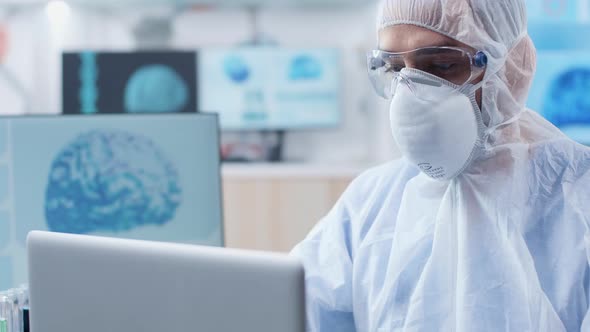 Handheld Shot of Chemist Researcher Working in Modern Laboratory