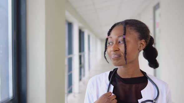 Smiling Young African Female Doctor Close Up Portrait