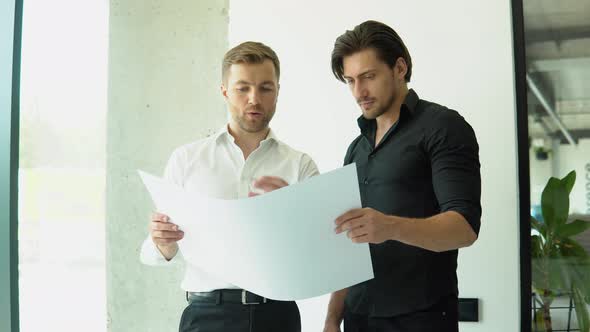 Two Businessman Engineers Working in Bright Clean Office