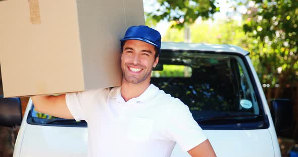 Delivery man carrying a parcel