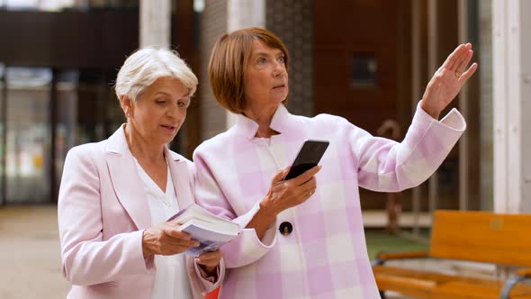 Senior Women with City Guide and Smartphone