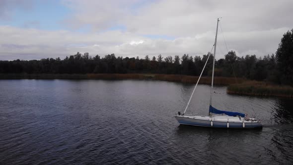 sailingboat at a dutch lake with sails down