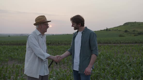 Two Farmers Shake Their Hands Together