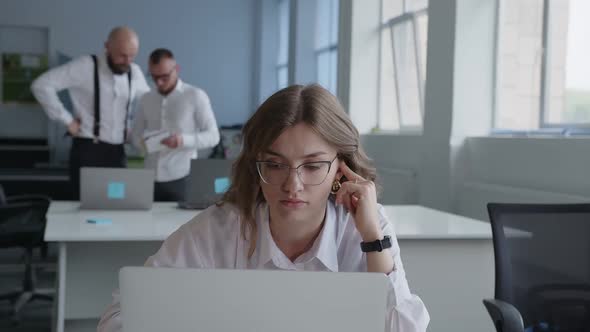 Girl Carefully Reads Something on the Computer Stuff