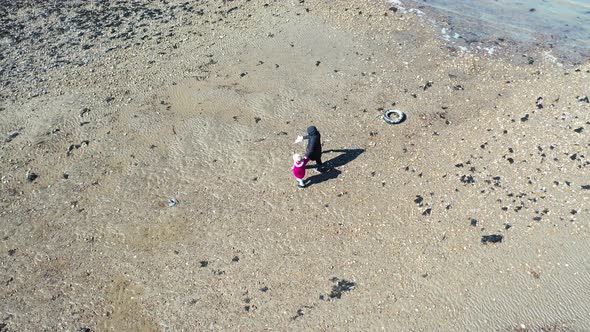 Aerial View of Mother and Little Daughter Walking on Beach, Whitstable, Kent