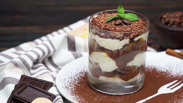 Classic Tiramisu Dessert in a Glass on Wooden Background