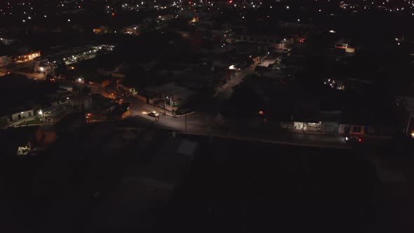 Forwards Fly Above Urban Neighbourhood at Night