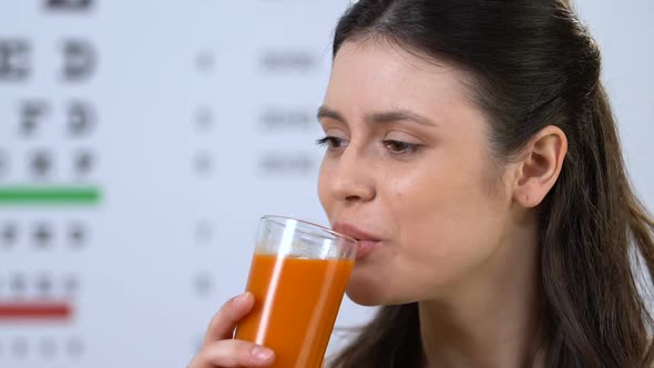 Female Drinking Delicious Carrot Juice, Supplement for Vision Health, Nutrition