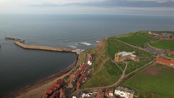 Flying Over Scenic Seaside Resort On Whitby Harbour In North Yorkshire, England. Aerial Drone Shot