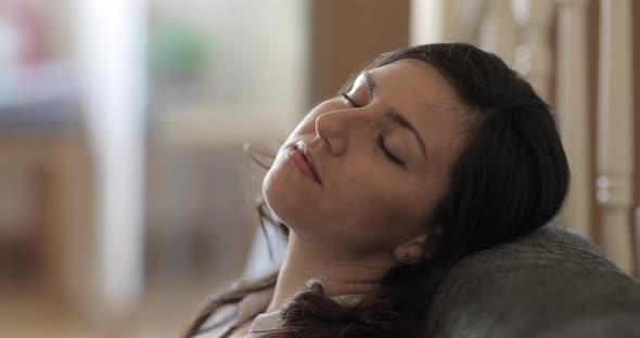 Authentic shot of young woman taking a break from remote work