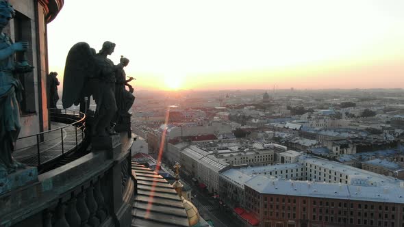 Holy Apostles on the Colonnade of St. Isaac's Cathedral in the Rays of the Rising Sun Aerial View