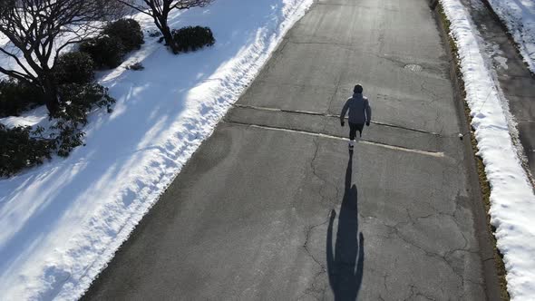 Man Running In Snow