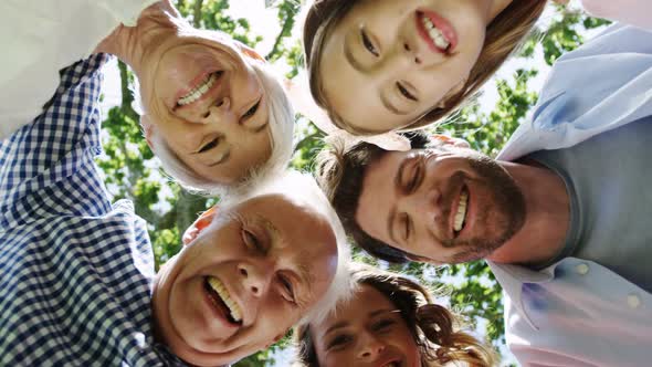 Multi-generation Family Forming Huddle in the Park