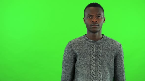 A Young Black Man Protests at the Camera - Green Screen Studio