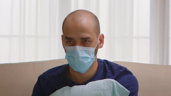 Man with Protection Mask Having a Panic Attack