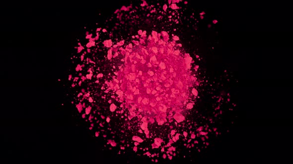 Super Slow Motion Shot of Rotating Pink Powder Expolosion Isolated on Black Background at 1000Fps