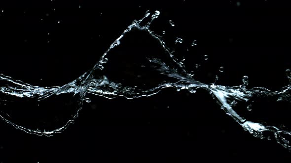 Super Slow Motion Shot of Swirling and Splashing Water Isolated on Black Background at 1000Fps