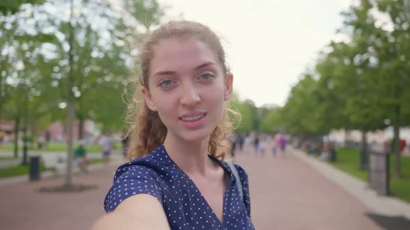 Young Caucasian Woman Doing Video Call at City Park