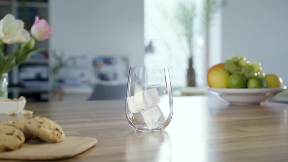 Putting Ice Cubes In To Glass