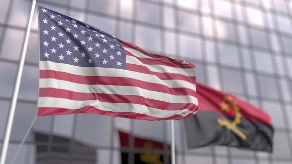 Flags of the United States and Angola in Front of a Skyscraper