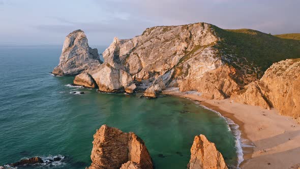 Aerial Fly Over Praia Da Ursa Beach in Sintra Portugal in Sunset Golden Hour Light