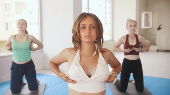 Three Women Having Yoga Classes in the Studio the Younger One Stands in the Front and Running Her