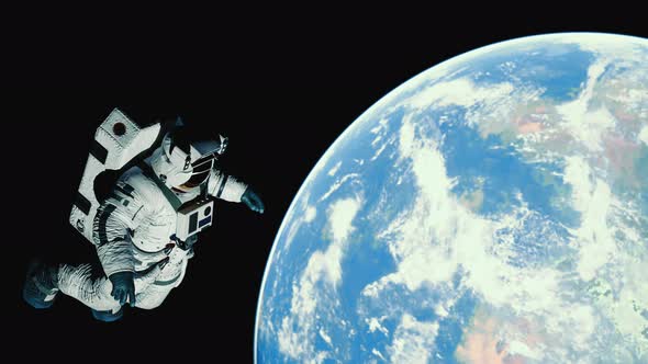 Astronaut in Outer Space Over the Planet Earth