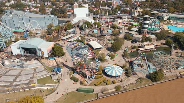 Daytime Aerial View Of Amusement Park Rides At Costa Park Along Lujan River In Tigre City, Buenos Ai