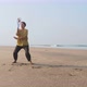 Senior Woman Practicing Tai Chi Balloon Ball on the Beach - VideoHive Item for Sale