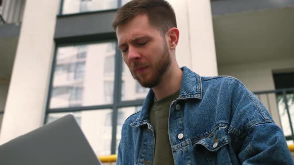 Shocked Frustrated Caucasian Man Student Feel Stressed Look at Computer Screen Worried of Problem