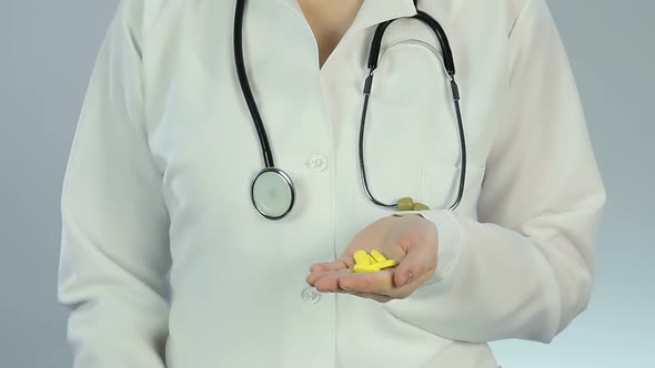 Pharmacist Looking at Pills Through Magnifier, Scientific Analysis, Quality Test