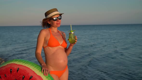 Pregnant Woman on a Beach