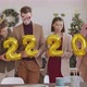 Happy Office Colleagues Holding Golden 2022 Balloons - VideoHive Item for Sale