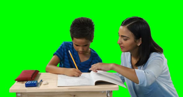 Mother helping her son while doing homework 4k