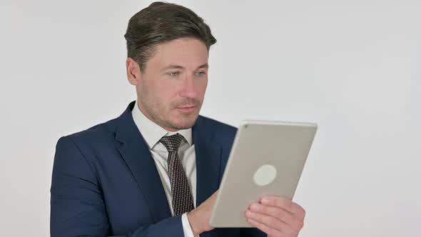 Middle Aged Businessman using Tablet, White Background