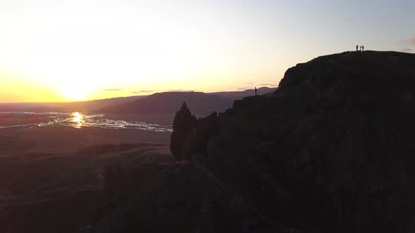 Revealing Aerial Motion Of Hiker On Top Of A Mountain In Iceland During Sunset