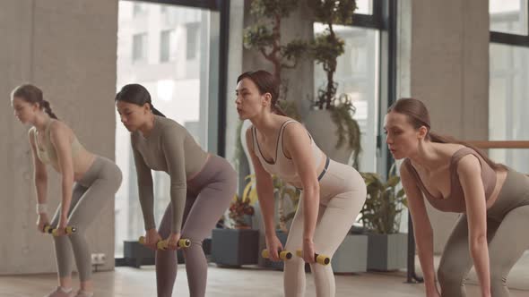 Women Performing Romanian Deadlift during Pilates Training