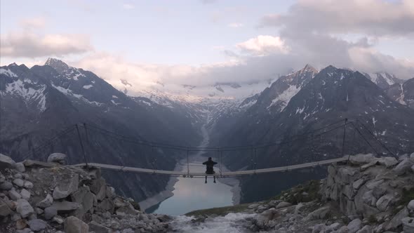 Aerial view of a person looking the Alps landscape, Italy. alt