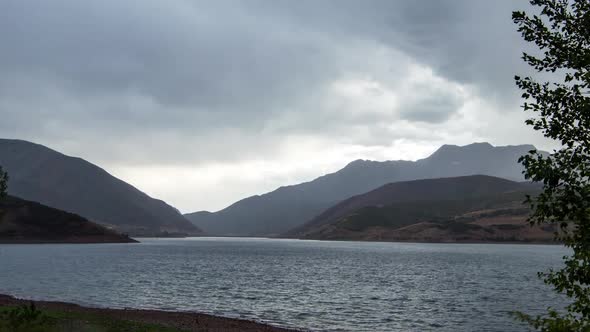 Time lapse of rain storm moving across lake