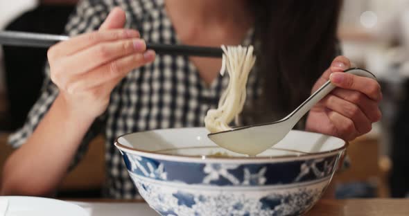 Woman Eat Noodles at Restaurant 