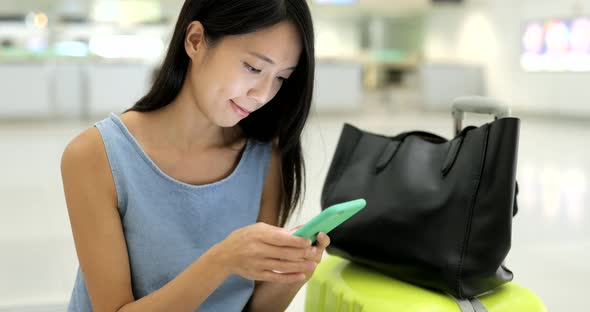 Woman Use of Cellphone in Airport of Hong Kong 