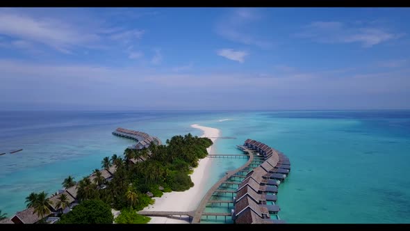 Aerial drone shot nature of idyllic sea view beach holiday by blue green lagoon with white sandy bac