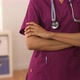 Close up mid section of African American Nurse crossing arms - VideoHive Item for Sale