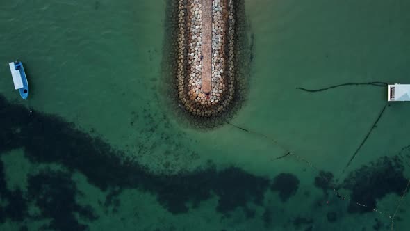 Top Down View on Wave Breaker on Balinese Beach